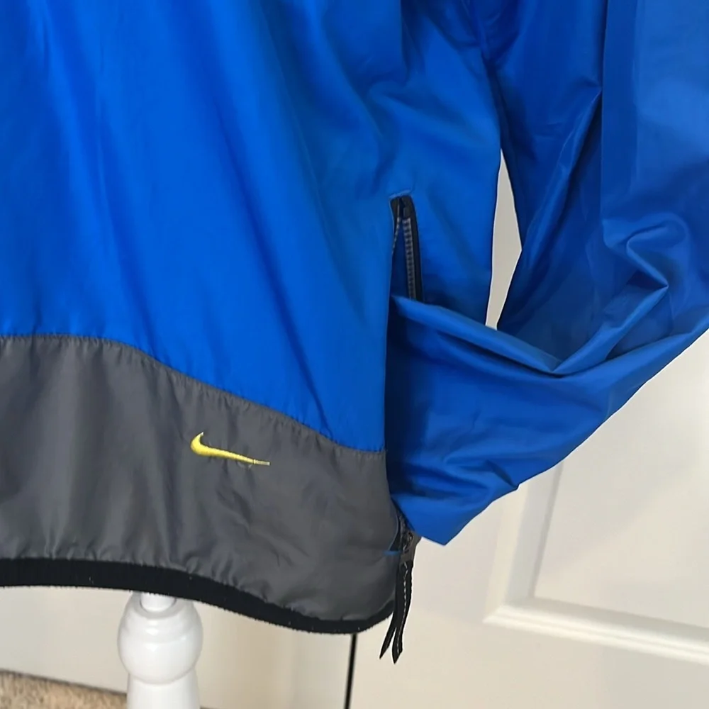 Nike youth L royal blue grey 1/2 zip windbreaker. Loose fit. Great condition